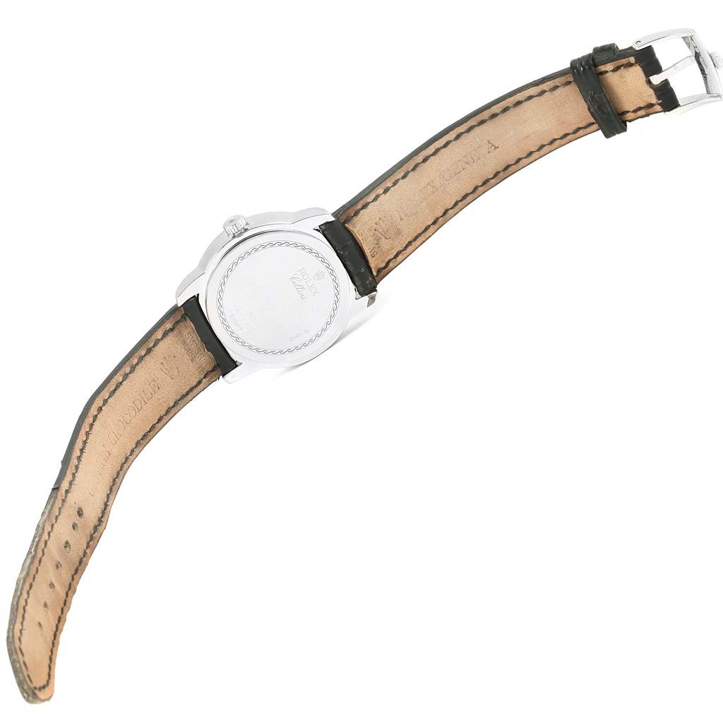 The image shows the back view of a Rolex Cellini 5240 Men's Platinum Mother of Pearl Dial 5240 Men's Platinum Mother of Pearl Dial watch with its leather strap and clasp.