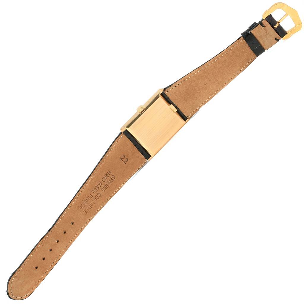 The image shows the back of a Rolex Cellini 4027 Men
s Yellow Gold Champagne Dial 4027 Men
s Yellow Gold Champagne Dial watch, displaying the leather strap and gold case.