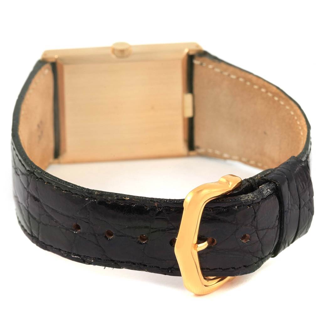 The image shows the back of a Rolex Cellini 4027 Men
s Yellow Gold Champagne Dial 4027 Men
s Yellow Gold Champagne Dial watch, focusing on the leather strap and gold buckle.