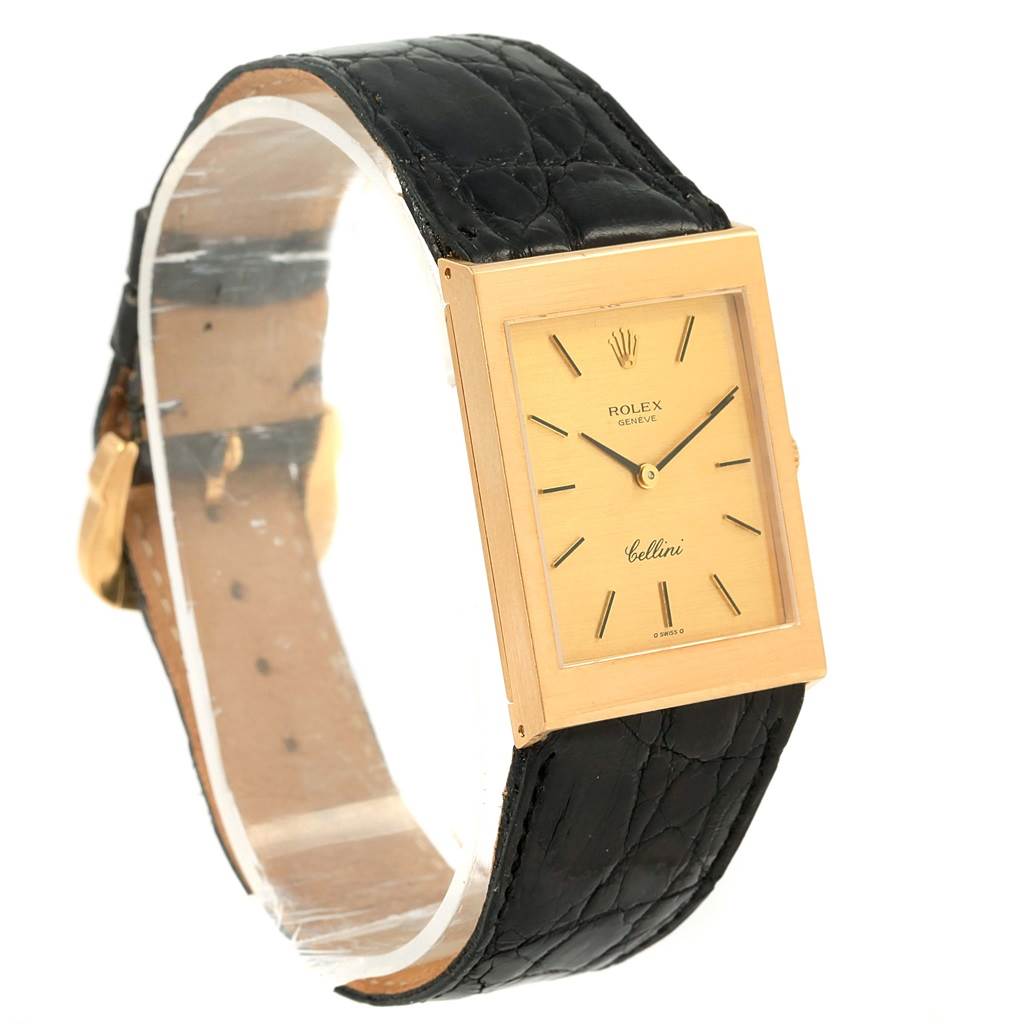 The image shows a Rolex Cellini 4027 Men
s Yellow Gold Champagne Dial 4027 Men
s Yellow Gold Champagne Dial watch angled to display its rectangular dial, black leather strap, and gold case.
