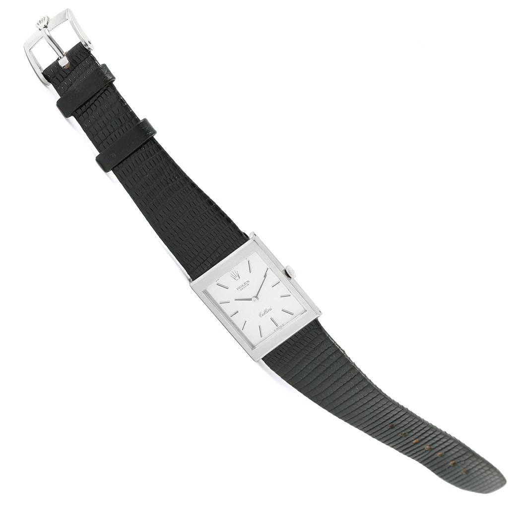 The image shows a top-down view of a Rolex Cellini 4014 Men's White Gold Silver Dial 4014 Men's White Gold Silver Dial watch, highlighting its rectangular dial, black strap, and buckle.