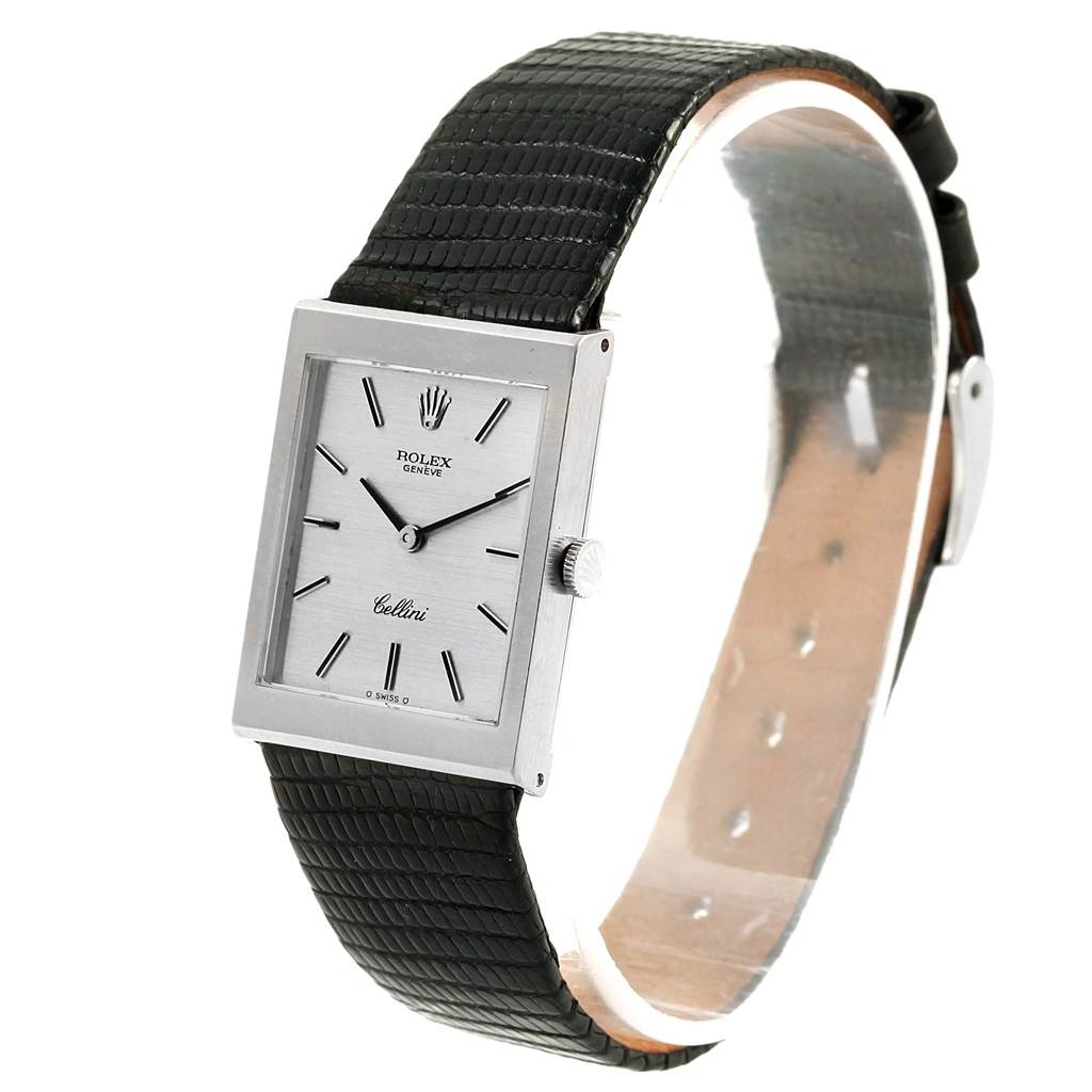 The Rolex Cellini 4014 Men's White Gold Silver Dial 4014 Men's White Gold Silver Dial watch is shown at a slight side angle, displaying its rectangular face, dial, hands, crown, and black leather strap.