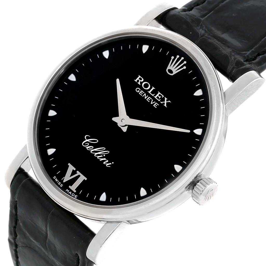 The Rolex Cellini 5115 White Gold Black Dial 5115 White Gold Black Dial watch is shown at an oblique angle, focusing on the black dial, hands, crown, and partial leather strap.