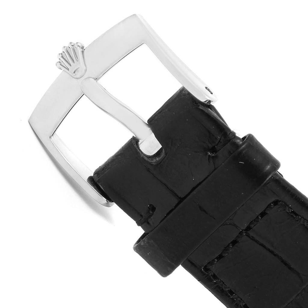 The image shows a close-up of the buckle and strap of a Rolex Cellini 5115 White Gold Black Dial 5115 White Gold Black Dial watch.