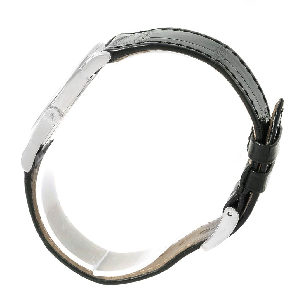 This image showcases the side view of a Rolex Cellini 5115 White Gold Black Dial 5115 White Gold Black Dial watch, highlighting its case, crown, and leather strap with a buckle.