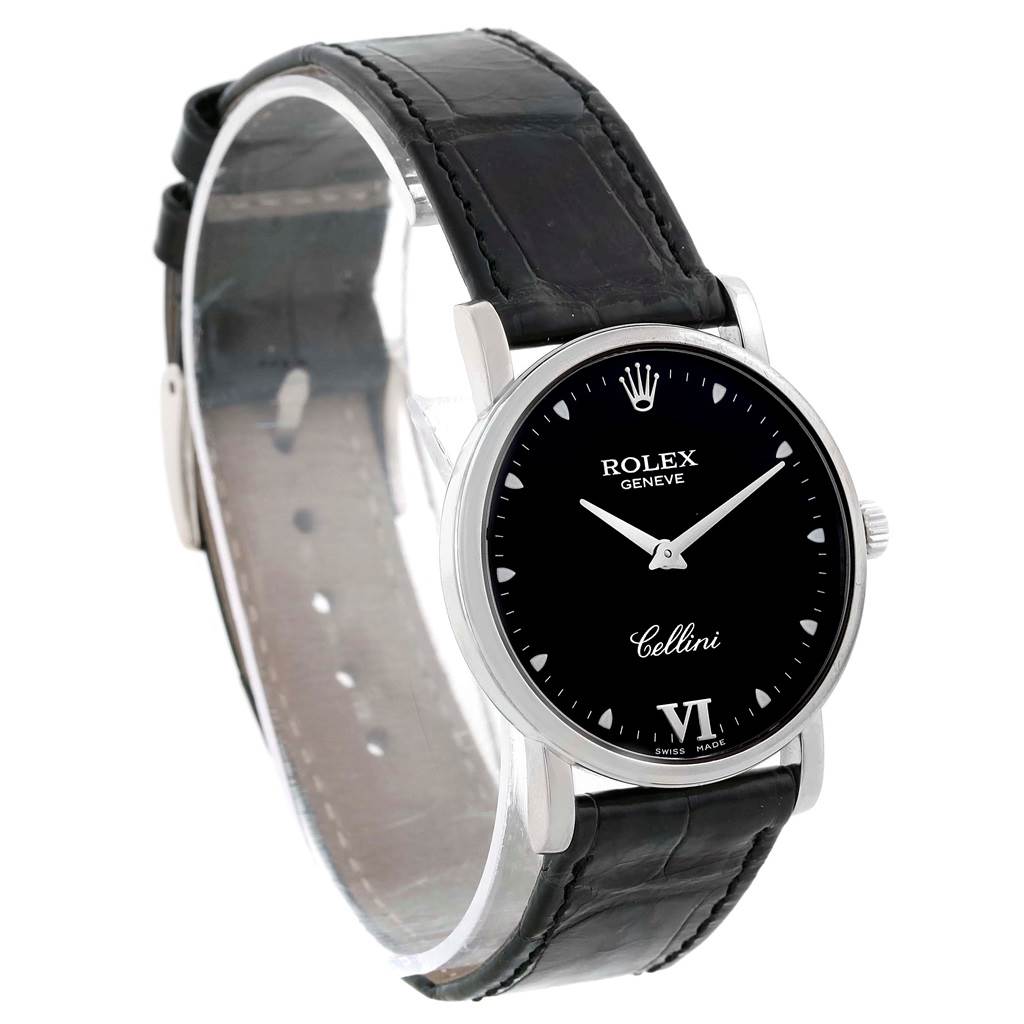 The image shows a Rolex Cellini 5115 White Gold Black Dial 5115 White Gold Black Dial watch at a front-side angle, highlighting its black dial, silver hands, and black leather strap.