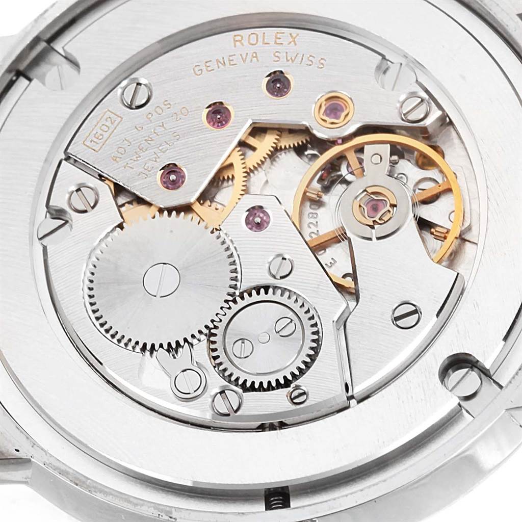 The image shows the intricate inner mechanism and gears of a Rolex Cellini 5115 White Gold Black Dial 5115 White Gold Black Dial model watch from a close-up, top-down angle.