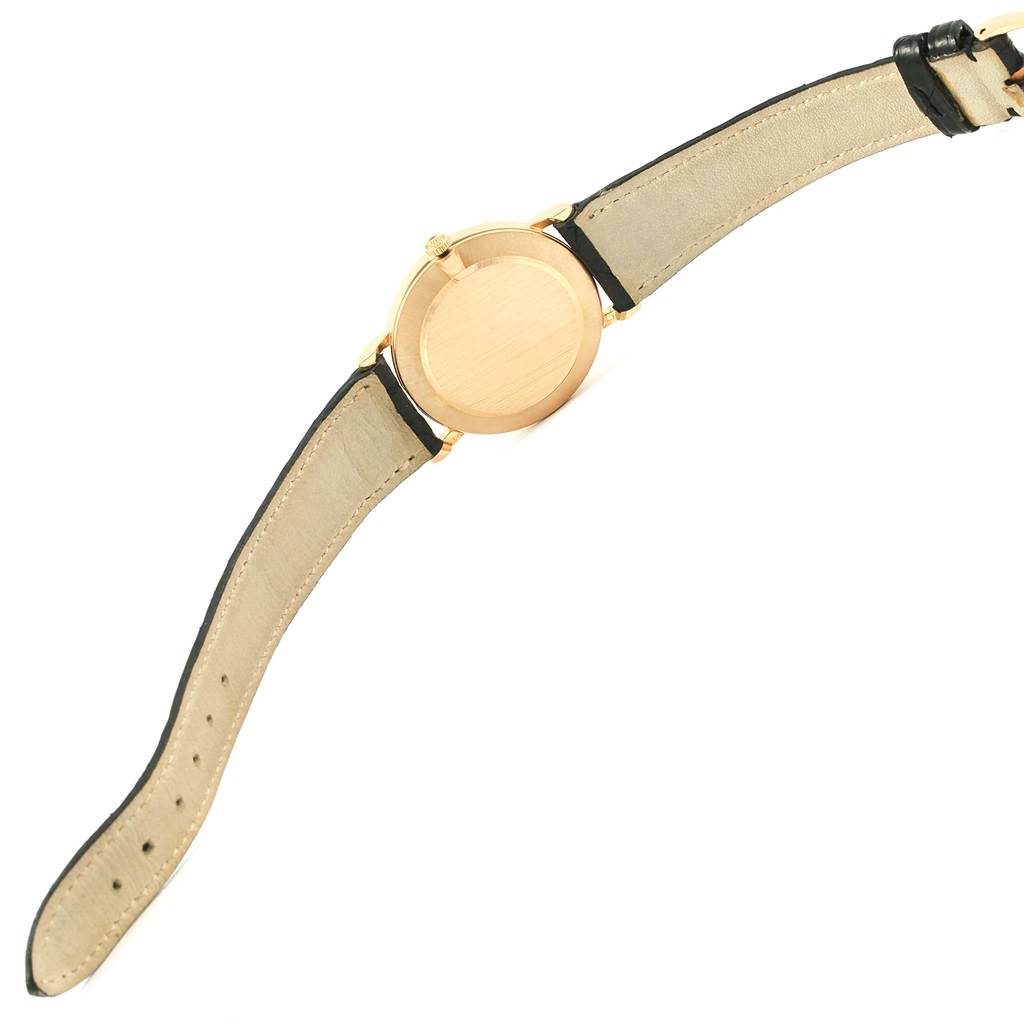 The image shows the back view of the Rolex Cellini 5112 Yellow Gold White Dial 5112 Yellow Gold White Dial watch, highlighting its gold case and leather strap.