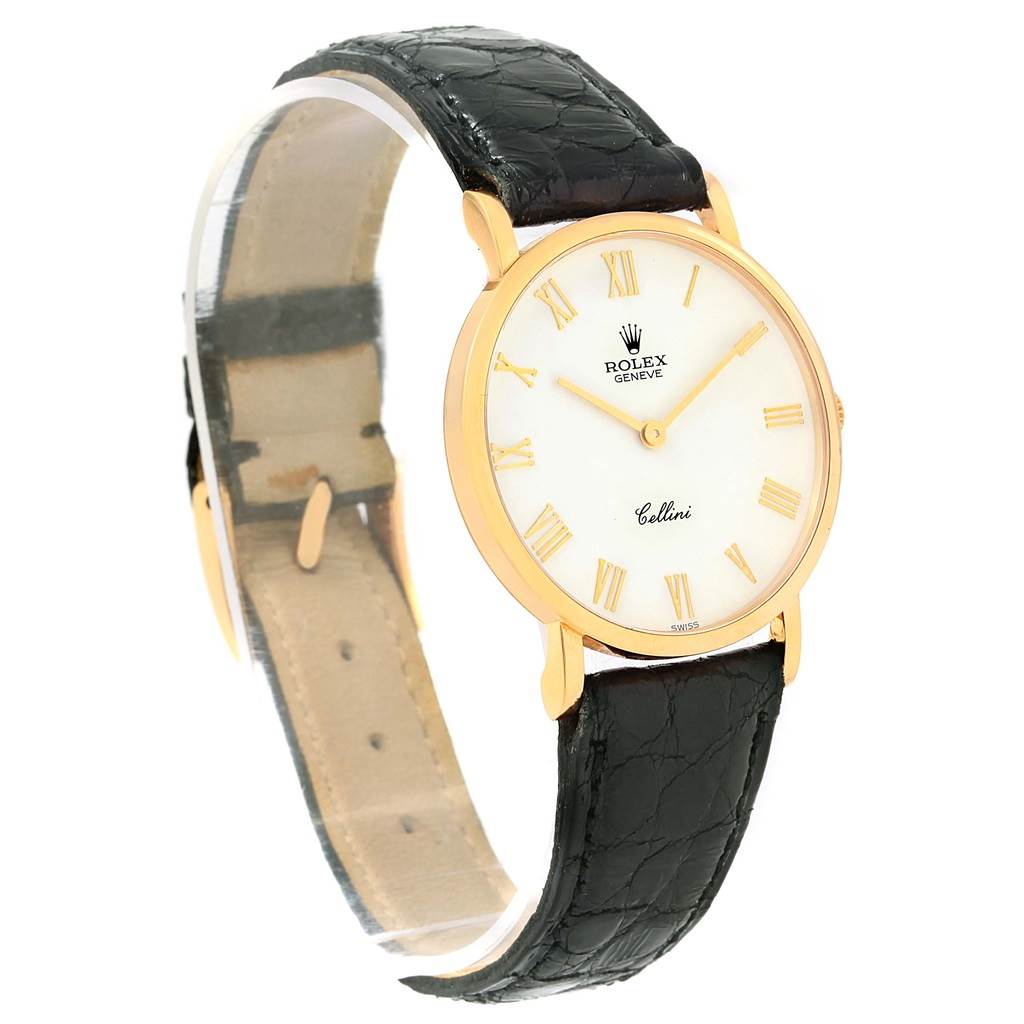 This image shows a side angle of the Rolex Cellini 5112 Yellow Gold White Dial 5112 Yellow Gold White Dial watch highlighting its dial, case, and black leather strap.