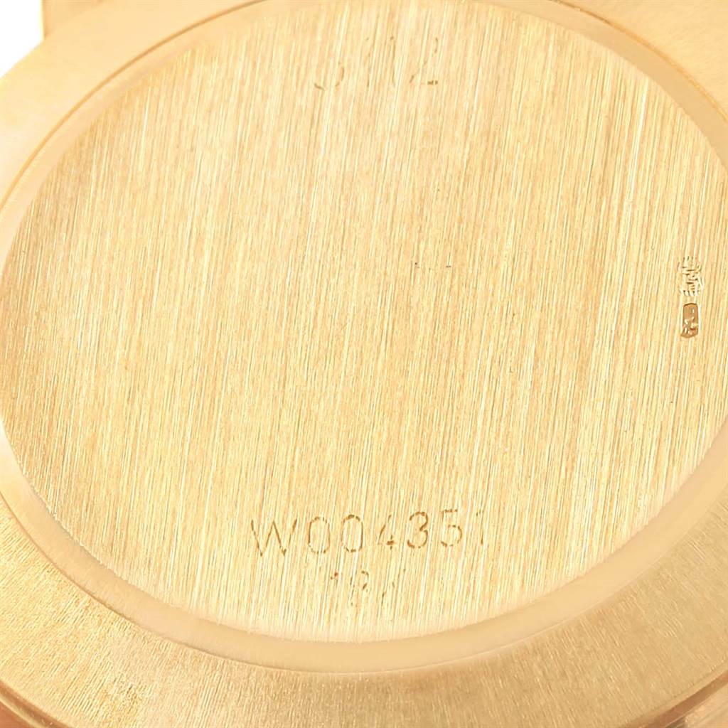 This is a close-up view of the back case of a Rolex Cellini 5112 Yellow Gold White Dial 5112 Yellow Gold White Dial watch.