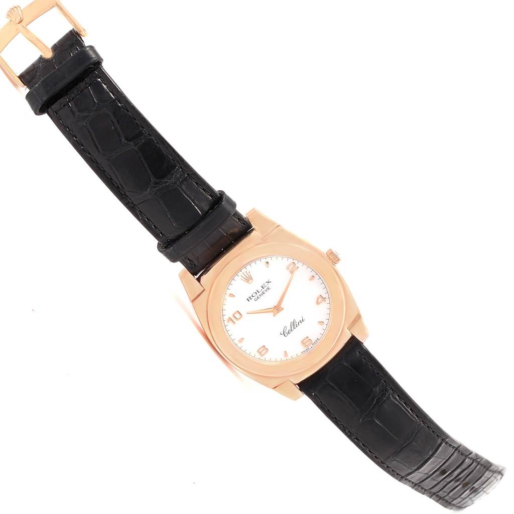 The image shows a Rolex Cellini 5330 Rose Gold Black Dial 5330 Rose Gold Black Dial watch featuring a rose gold round case, white dial, gold markers, and black leather strap at an angled view.