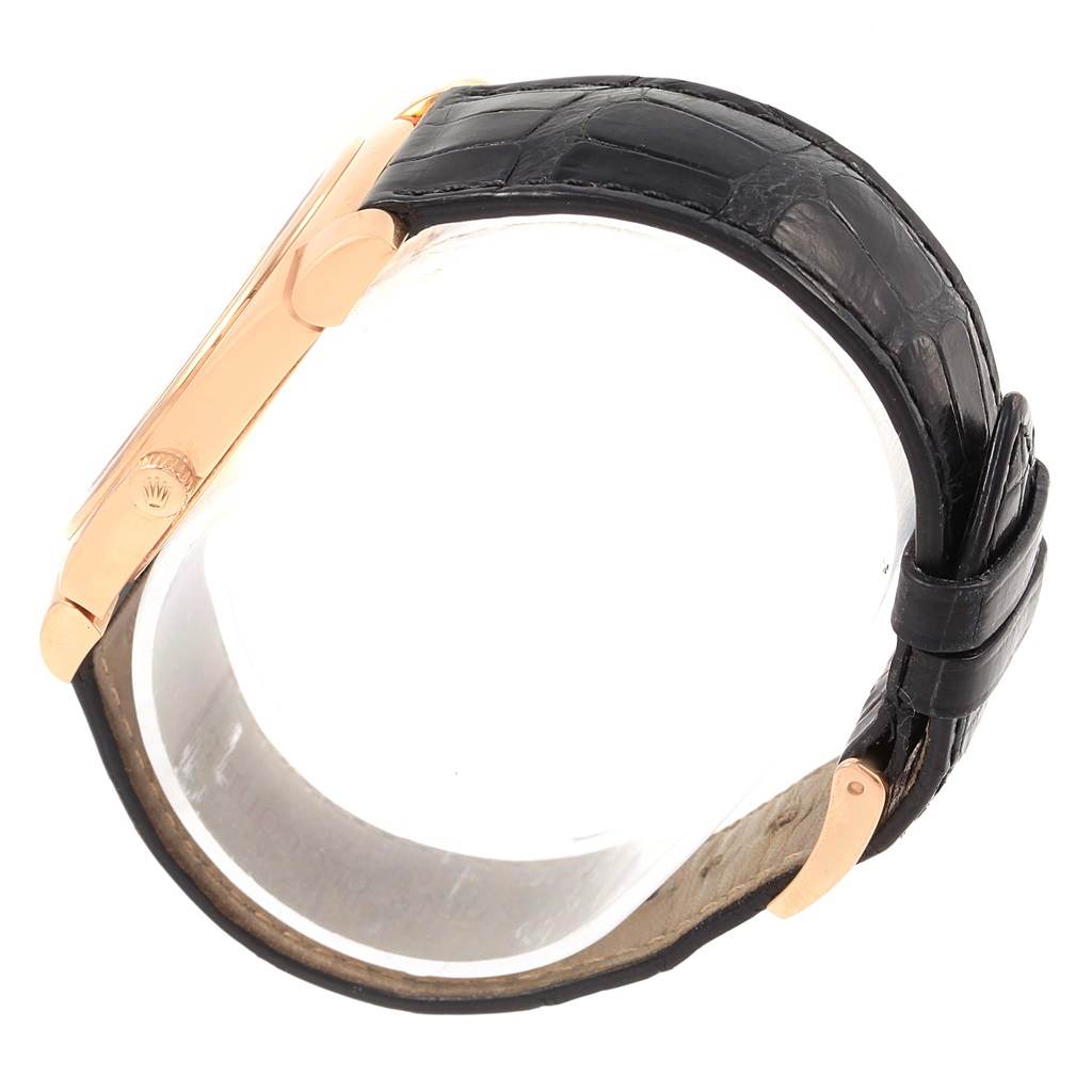 This image shows a side view of a Rolex Cellini 5330 Rose Gold Black Dial 5330 Rose Gold Black Dial watch, highlighting its leather strap and gold case.