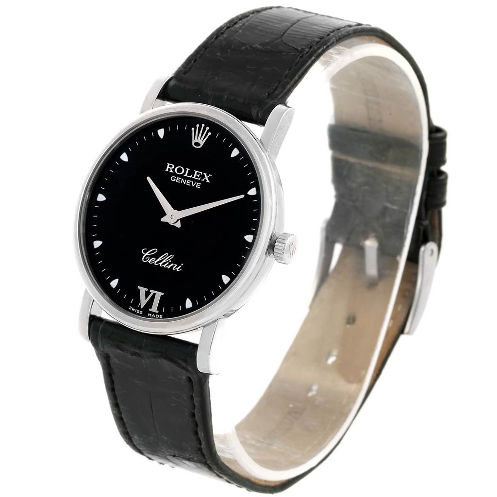 This image shows a Rolex Cellini 5115 White Gold Black Dial 5115 White Gold Black Dial watch at an angled side view, displaying the face, crown, and leather strap.