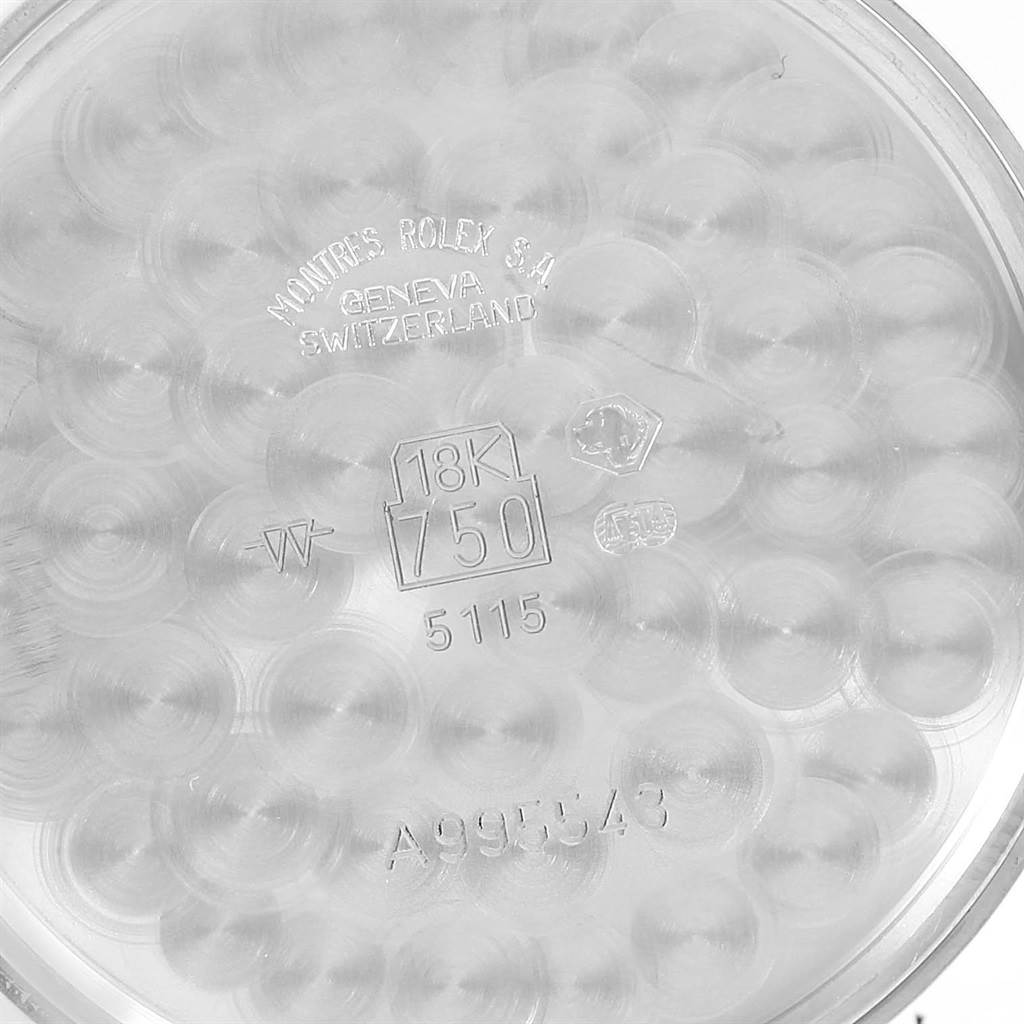 The image shows the inner case back of a Rolex Cellini 5115 White Gold Black Dial 5115 White Gold Black Dial watch, featuring engravings and hallmarks.