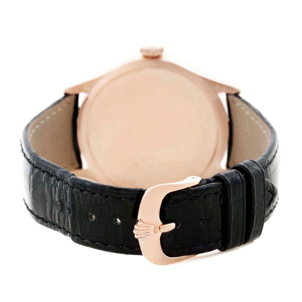 The image shows the back view of a Rolex Cellini 50515 Men's Rose Gold Black Dial 50515 Men's Rose Gold Black Dial watch, featuring its case back and black leather strap with a clasp.