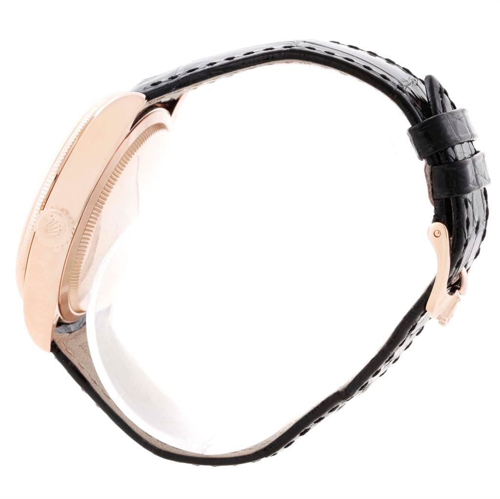 This image shows a Rolex Cellini 50515 Men's Rose Gold Black Dial 50515 Men's Rose Gold Black Dial watch from a side angle, highlighting its bezel, crown, and leather strap with a clasp.