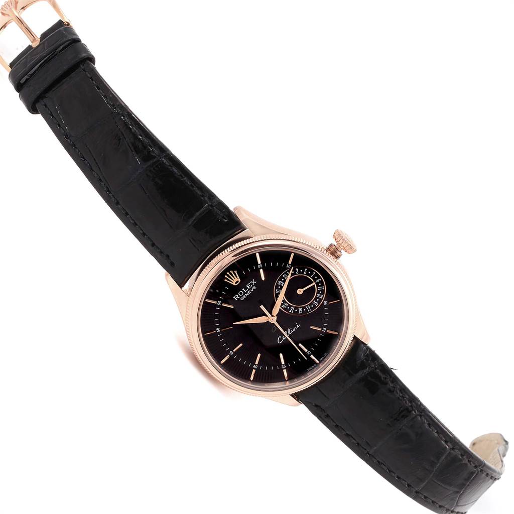 The image shows a Rolex Cellini 50515 Men's Rose Gold Black Dial 50515 Men's Rose Gold Black Dial model watch at an angle displaying its face, crown, and leather strap.