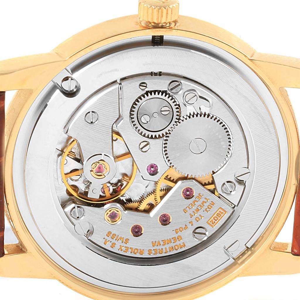 This image shows the back of the Rolex Cellini 5116 Yellow Gold Mother of Pearl Dial 5116 Yellow Gold Mother of Pearl Dial watch, highlighting its intricate movement and internal mechanisms.