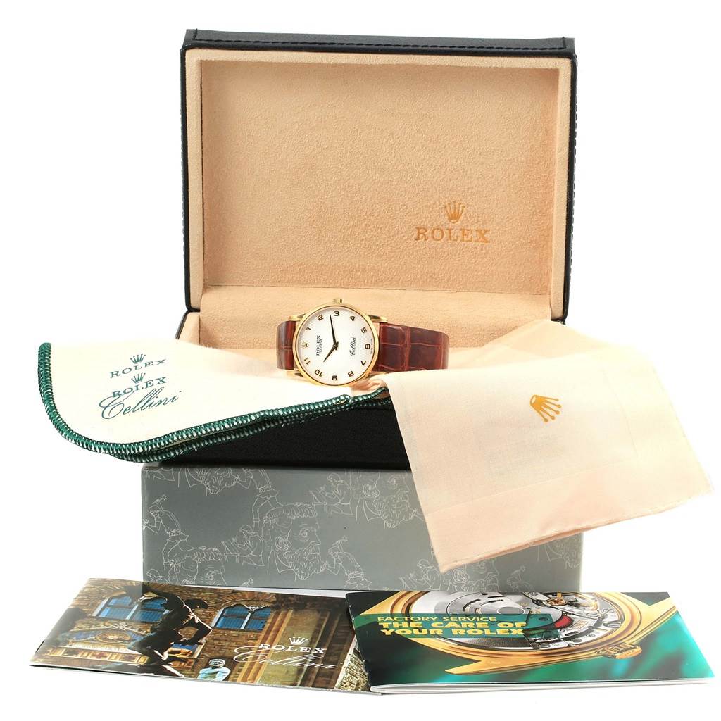 The Rolex Cellini 5116 Yellow Gold Mother of Pearl Dial 5116 Yellow Gold Mother of Pearl Dial watch is shown from the front in its open box, accompanied by booklets and cloths.