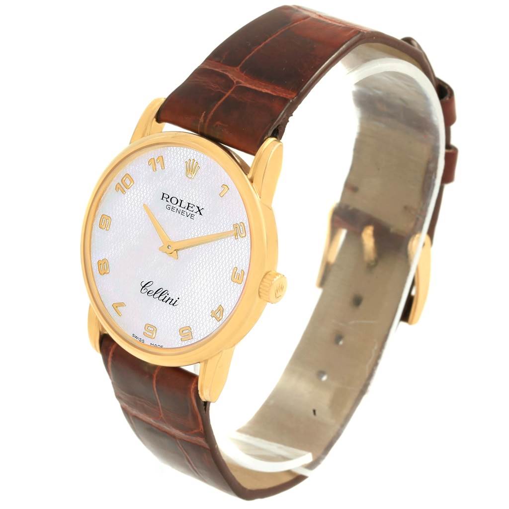 This image shows a Rolex Cellini 5116 Yellow Gold Mother of Pearl Dial 5116 Yellow Gold Mother of Pearl Dial model watch at a three-quarter angle, displaying its dial, case, and brown leather strap.
