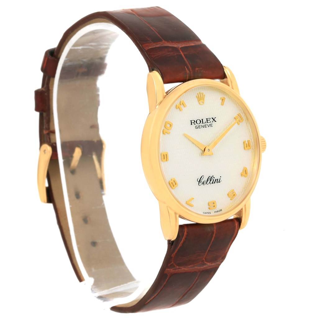 The image shows a Rolex Cellini 5116 Yellow Gold Mother of Pearl Dial 5116 Yellow Gold Mother of Pearl Dial watch at a slight angle, highlighting its gold case, brown leather strap, and white dial.