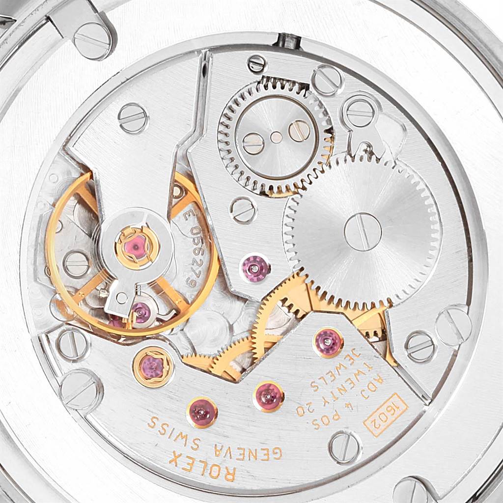This image shows a close-up of the movement mechanism of a Rolex Cellini 5116 Men
s White Gold Silver Dial 5116 Men
s White Gold Silver Dial watch, highlighting gears, jewels, and intricate components.