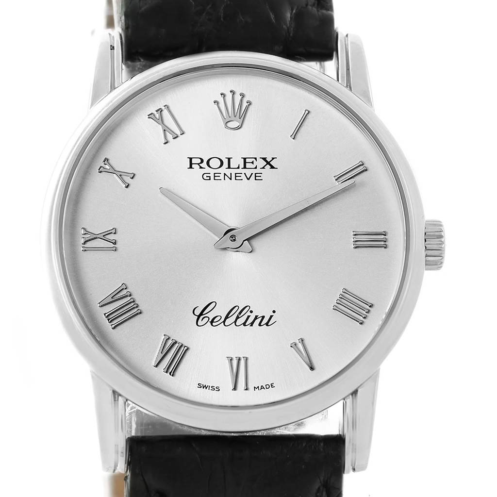 The Rolex Cellini 5116 Men
s White Gold Silver Dial 5116 Men
s White Gold Silver Dial watch is shown from a front angle, displaying its face, hands, crown, and part of the leather strap.
