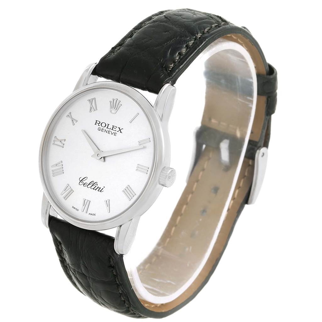 The image shows a Rolex Cellini 5116 Men
s White Gold Silver Dial 5116 Men
s White Gold Silver Dial watch at a slight angle, displaying its face, case, crown, and leather strap.