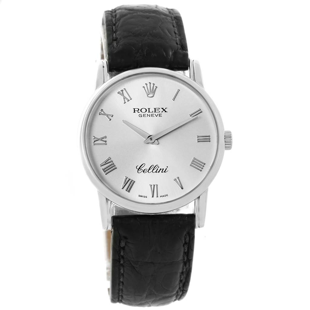 The image shows a frontal view of a Rolex Cellini 5116 Men
s White Gold Silver Dial 5116 Men
s White Gold Silver Dial watch with a black leather strap and a silver dial featuring Roman numerals.