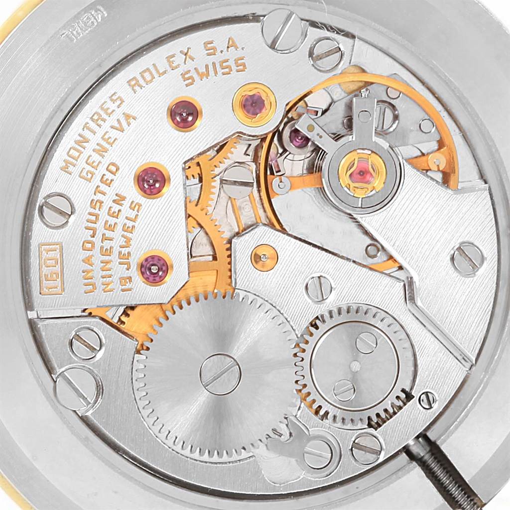 Close-up of the Cellini model by Rolex, showing its intricate mechanical movement and internal components.