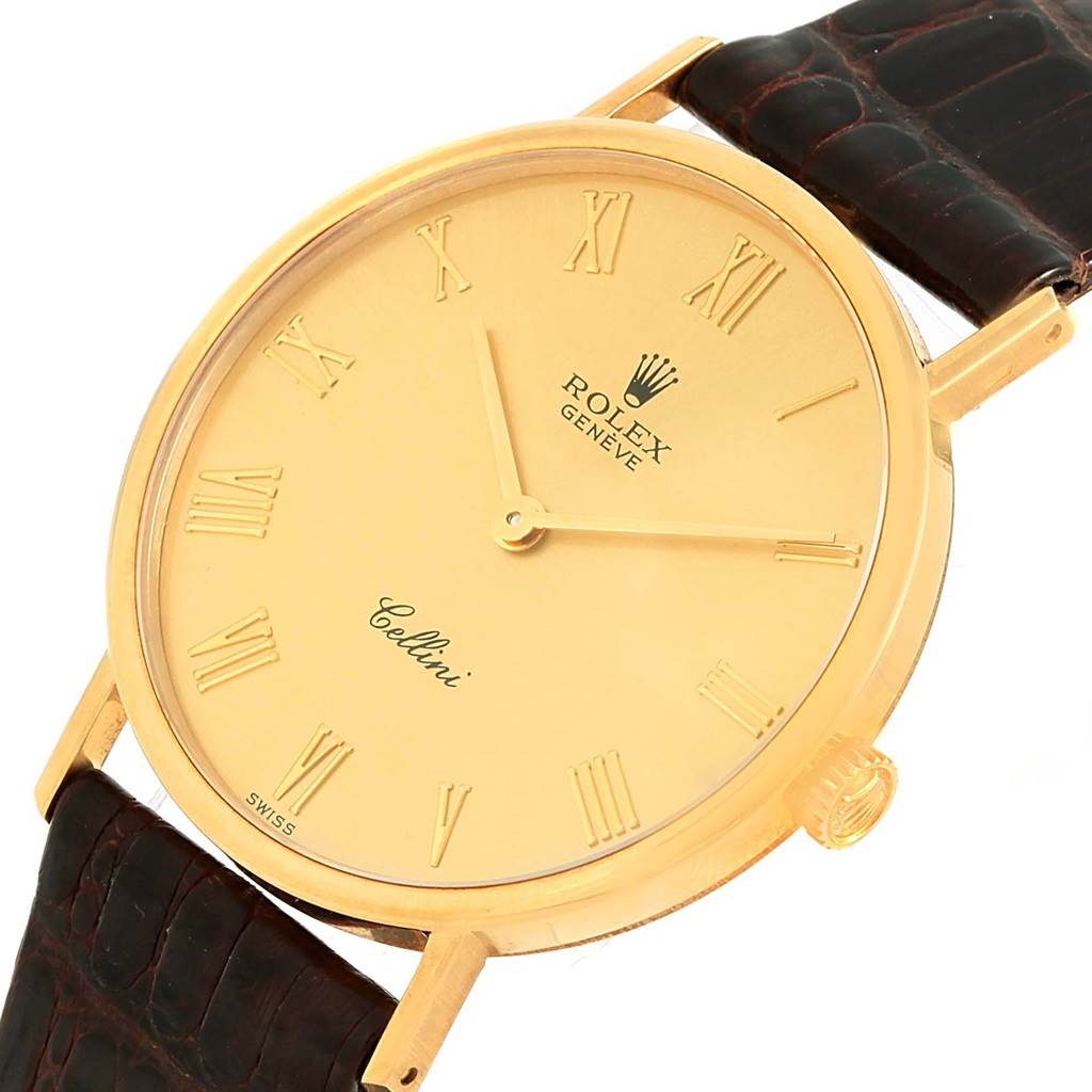 This image shows a Rolex Cellini 5112 Yellow Gold Champagne Dial 5112 Yellow Gold Champagne Dial watch from an angled top view, focusing on the dial, bezel, and part of the strap.