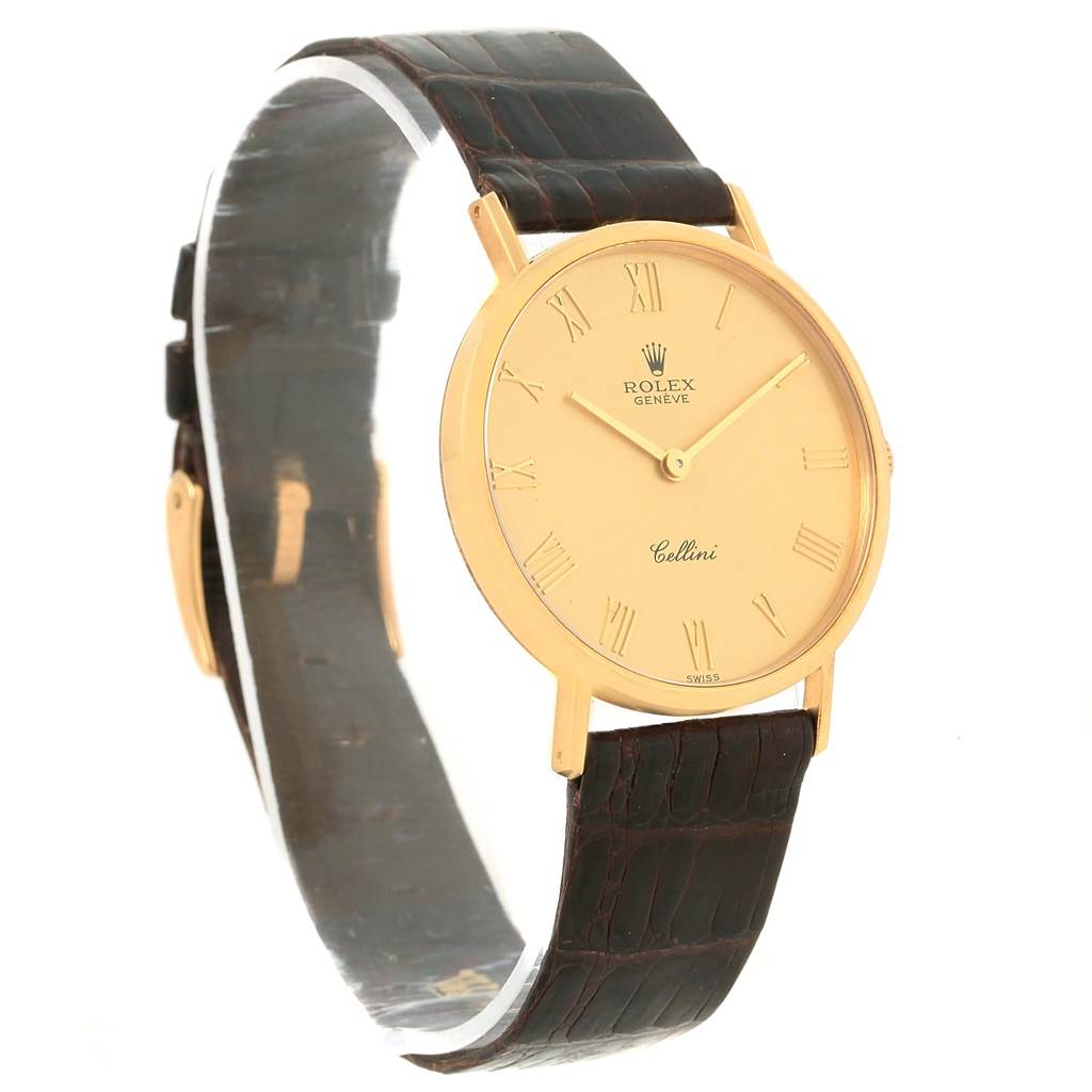 The image shows a Rolex Cellini 5112 Yellow Gold Champagne Dial 5112 Yellow Gold Champagne Dial watch with a gold-tone case, Roman numeral dial, and brown leather strap at a slight front-right angle.