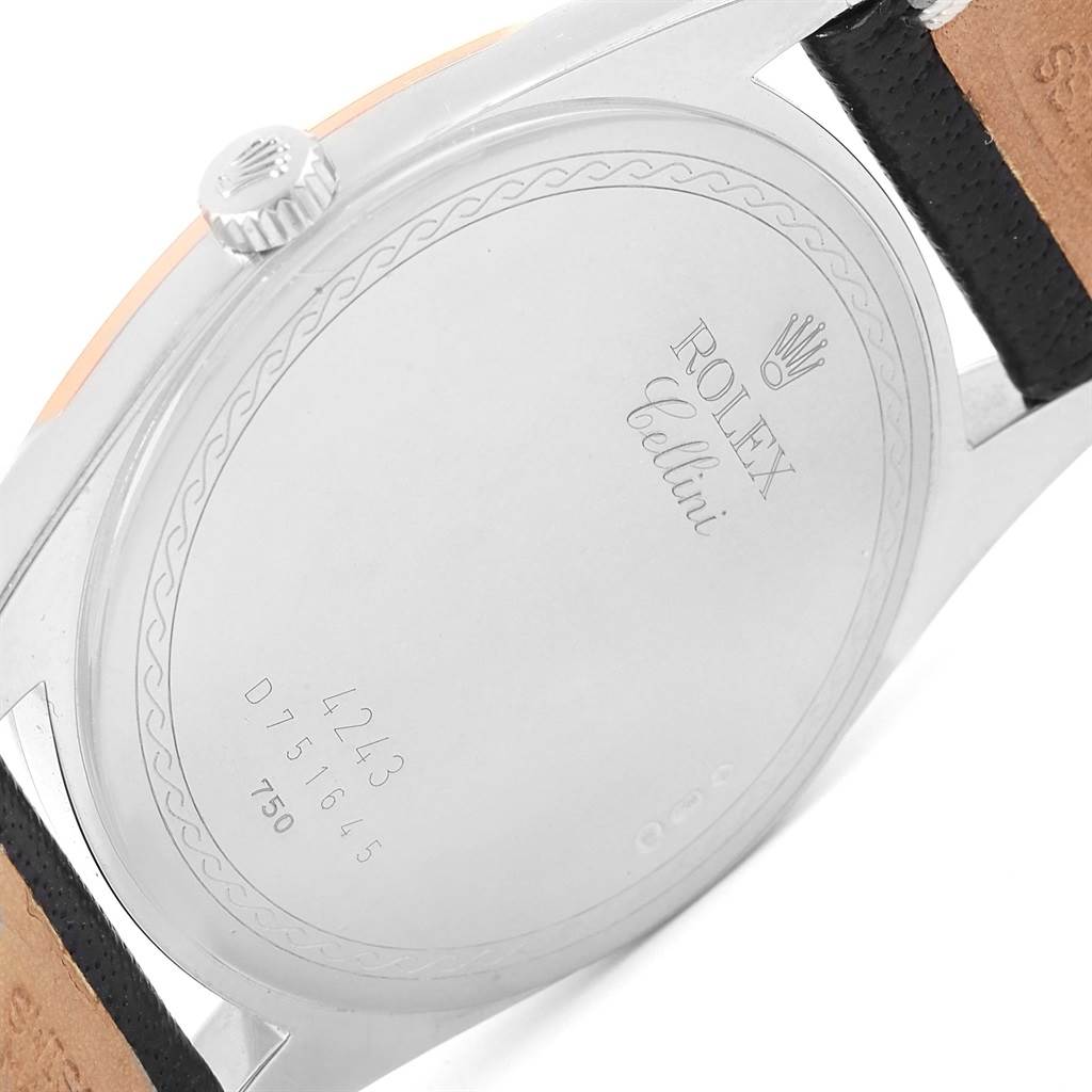 The image shows the back case of a Rolex Cellini 4243 Men
s White Gold White Dial 4243 Men
s White Gold White Dial watch, displaying the markings and part of the leather strap.