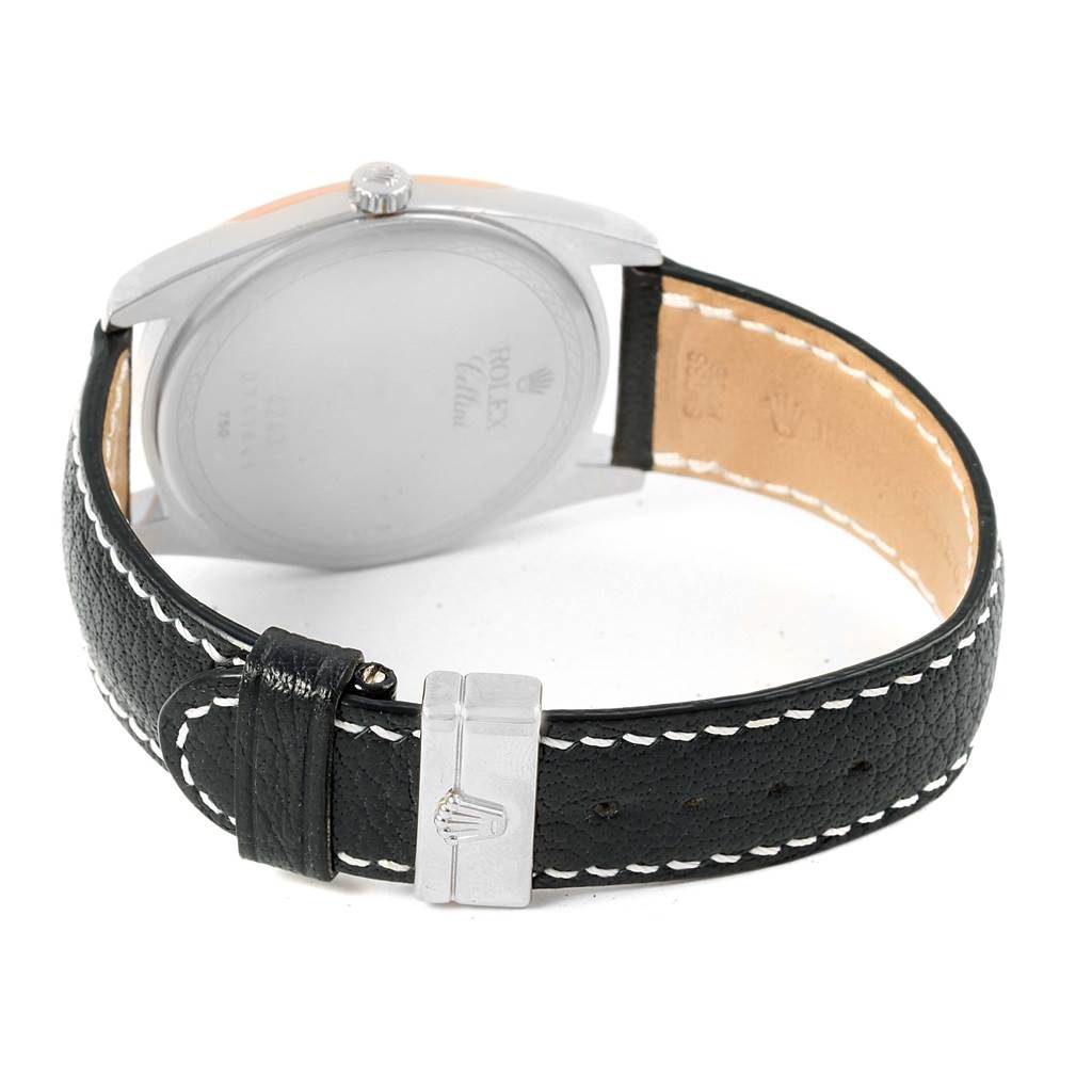 The image shows the back view of a Rolex Cellini 4243 Men
s White Gold White Dial 4243 Men
s White Gold White Dial watch, highlighting the case back, crown, and leather strap with buckle.