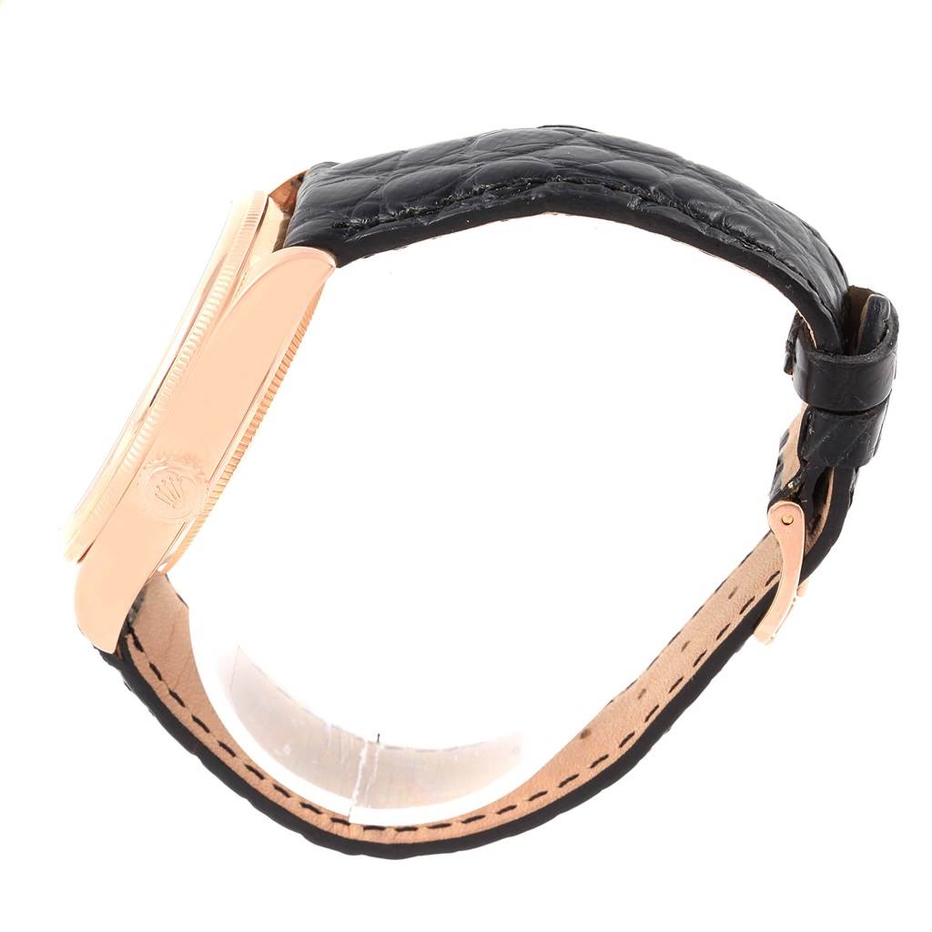 This image shows a side view of the Rolex Cellini 50515 Men's Rose Gold Silver Dial 50515 Men's Rose Gold Silver Dial watch, focusing on its case and leather strap.