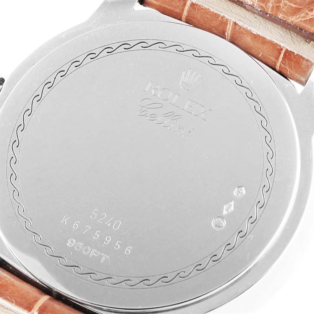 This image shows the back case of a Rolex Cellini 5240 Men's Platinum Mother of Pearl Dial 5240 Men's Platinum Mother of Pearl Dial watch, featuring its markings and a brown leather strap.