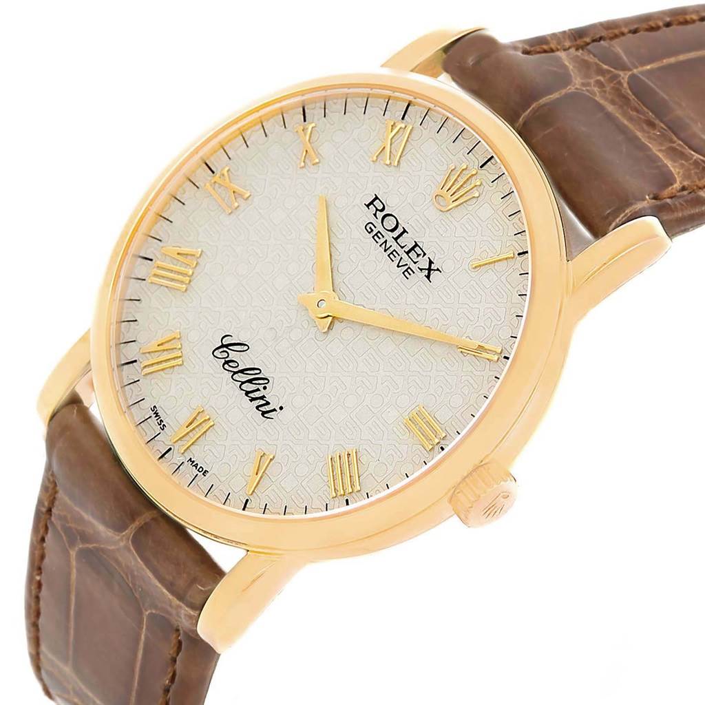 The Rolex Cellini 5115 Men's Yellow Gold Beige Dial 5115 Men's Yellow Gold Beige Dial watch is shown at a slight angle, displaying its face, crown, and leather strap.