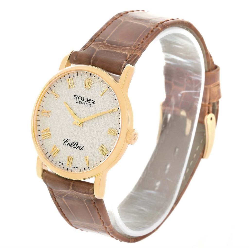 This image shows a Rolex Cellini 5115 Men's Yellow Gold Beige Dial 5115 Men's Yellow Gold Beige Dial watch at an angled view, displaying its face, case, crown, and brown leather strap.