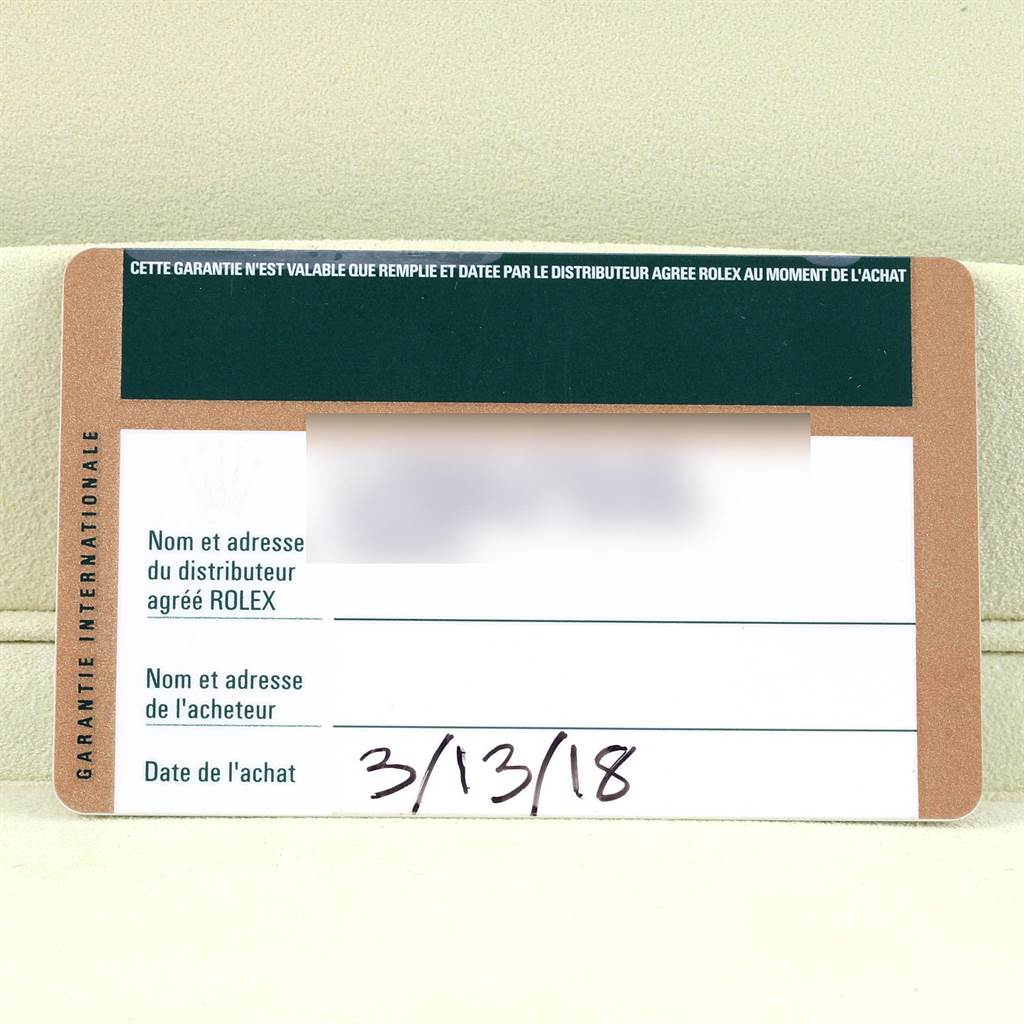 This image showcases a guarantee card for a Rolex Cellini 5330 Men
s White Gold White Dial 5330 Men
s White Gold White Dial model, displaying dealer information and purchase date.