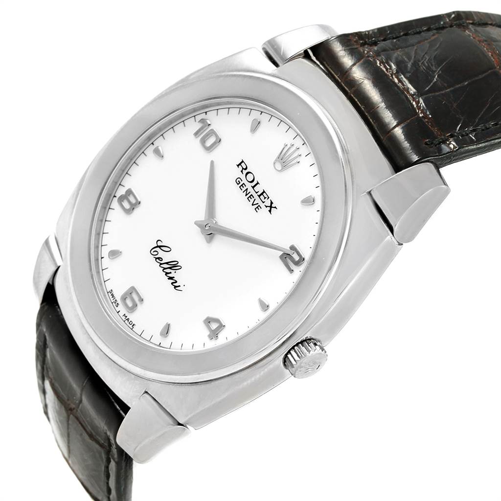 The Rolex Cellini 5330 Men
s White Gold White Dial 5330 Men
s White Gold White Dial watch is shown at an angle, displaying its face, crown, lugs, and part of the leather strap.