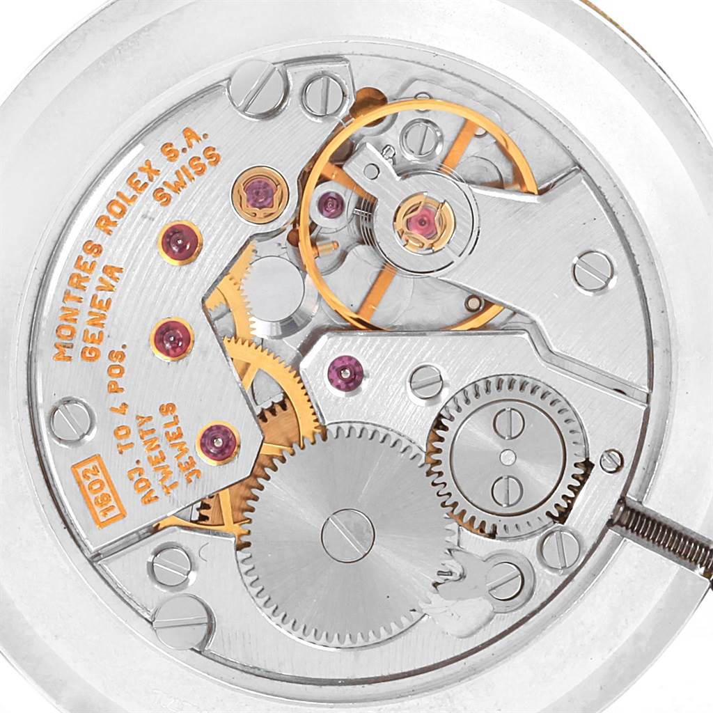 This image shows the internal mechanical movement of a Rolex Cellini 5112 Yellow Gold Mother of Pearl Dial 5112 Yellow Gold Mother of Pearl Dial watch, focusing on gears and components.