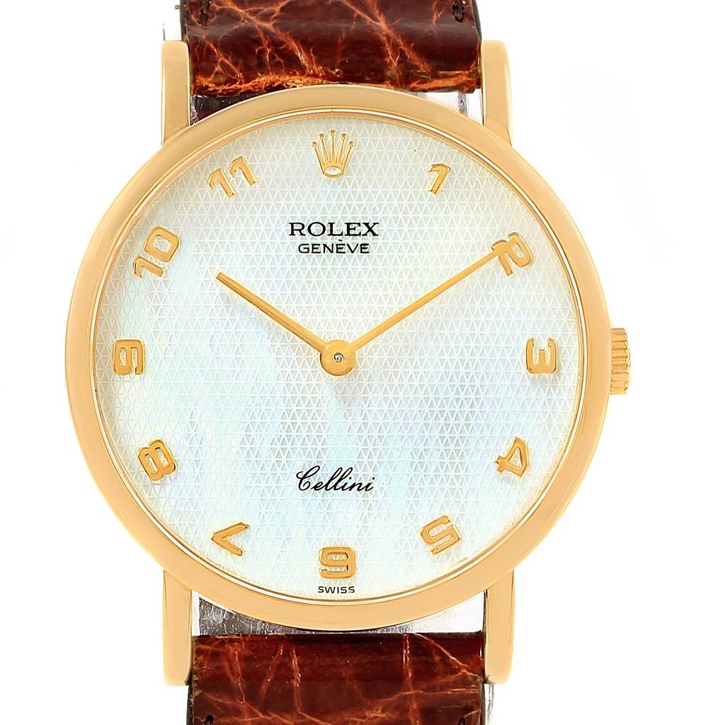 The image shows a Rolex Cellini 5112 Yellow Gold Mother of Pearl Dial 5112 Yellow Gold Mother of Pearl Dial watch from a frontal view, displaying its golden bezel, dial, and brown leather strap.