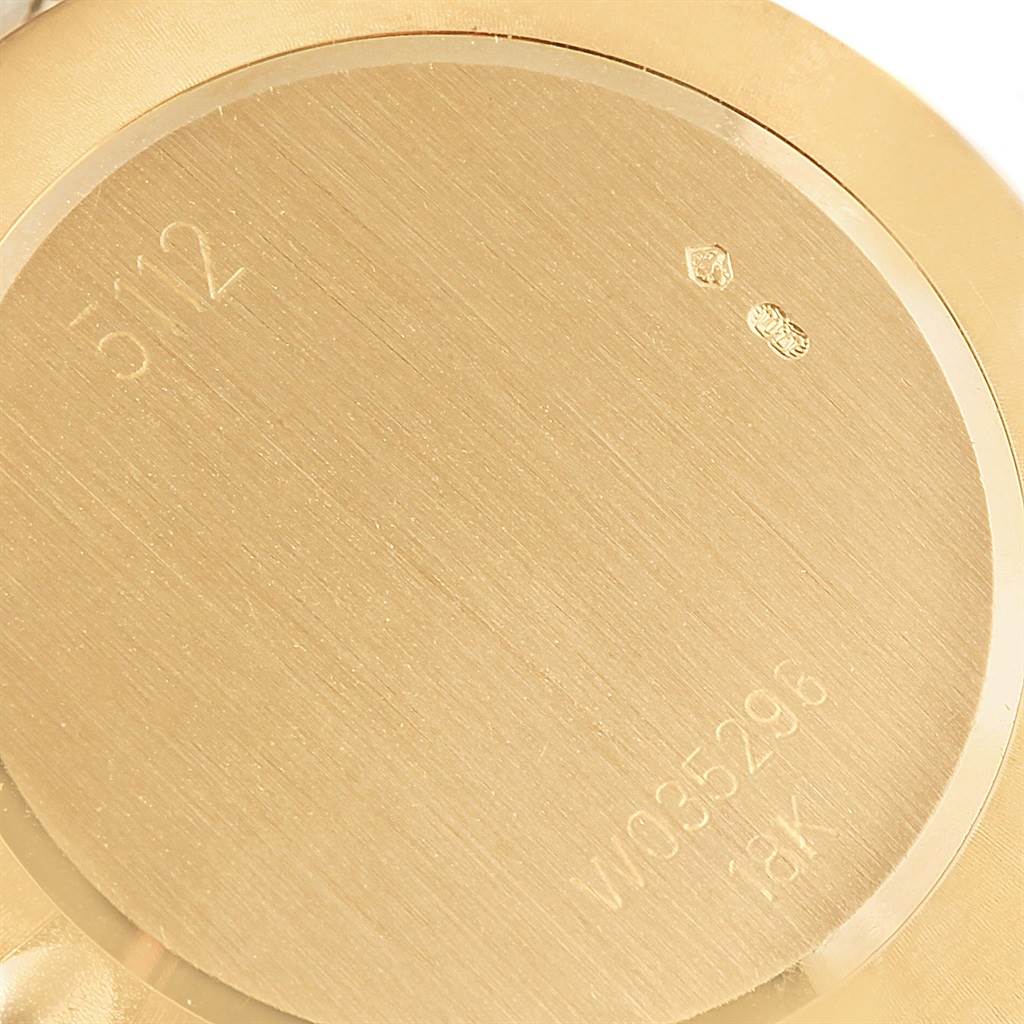 The image shows the back case of a Rolex Cellini 5112 Yellow Gold Mother of Pearl Dial 5112 Yellow Gold Mother of Pearl Dial model watch, highlighting embossed and engraved details.