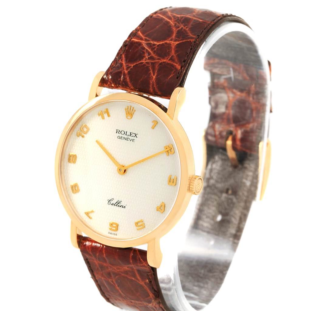 The image shows a Rolex Cellini 5112 Yellow Gold Mother of Pearl Dial 5112 Yellow Gold Mother of Pearl Dial watch with a gold case, white dial, leather strap, and Arabic numerals, viewed from an angled front perspective.