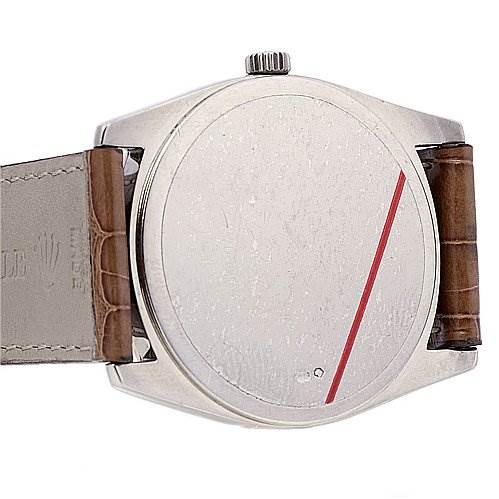 This image shows the back case and part of the leather strap of a Rolex Cellini 4233 White Gold Black Dial 4233 White Gold Black Dial watch, viewed from the rear.