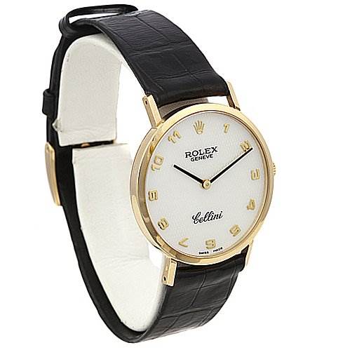 The Rolex Cellini 4112 Yellow Gold Mother of Pearl Dial 4112 Yellow Gold Mother of Pearl Dial watch is shown from a front left angle, highlighting its white dial, gold case, and black leather strap.