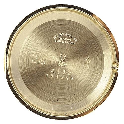 This image shows the inside case back of a Rolex Cellini 4112 Yellow Gold Mother of Pearl Dial 4112 Yellow Gold Mother of Pearl Dial watch, highlighting its engravings and serial numbers.