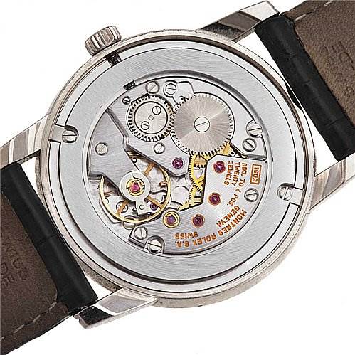 The image shows the back view of a Rolex Cellini 5116/9 White Gold Beige Dial 5116/9 White Gold Beige Dial watch, highlighting the intricate mechanical movement and internal components.