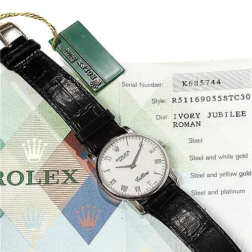 The image shows the top view of a Rolex Cellini 5116/9 White Gold Beige Dial 5116/9 White Gold Beige Dial watch with a leather strap, alongside its certificate and tag.