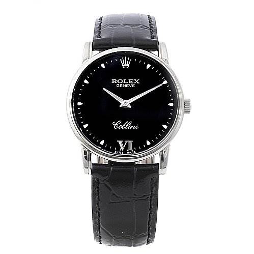 The Rolex Cellini 5116/9 White Gold Black Dial 5116/9 White Gold Black Dial watch is shown from a front angle, highlighting the black dial, silver indices, and black leather strap.